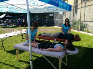Kristen and Libby providing treatments to athletes at the Triathlon of Compassion 2016