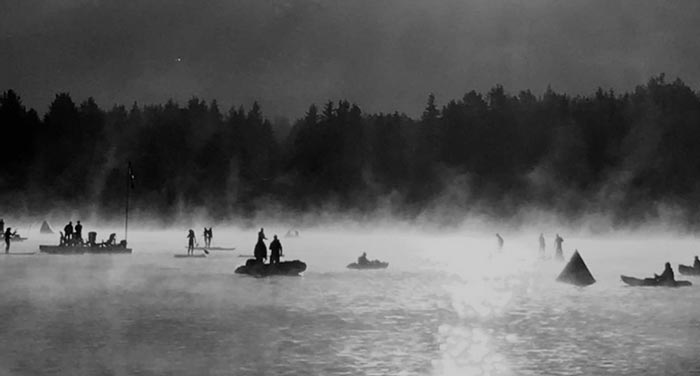 The fog rises off the water in the early morning of the Whistler 70.3 Ironman Triathlon