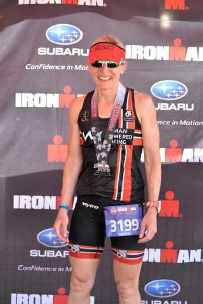 Sandy Wilson with her medal at the Whistler Ironman Triathlon 70.3