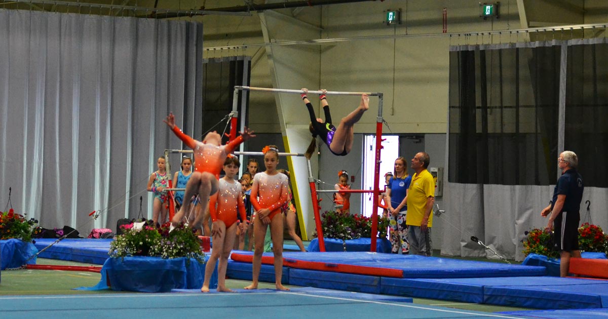 Gymnastics athletes from Edmonton compete on the floor and on the uneven bars.