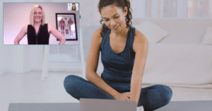 An athlete sits in her living room getting ready for an online appointment with Sandy Wilson.