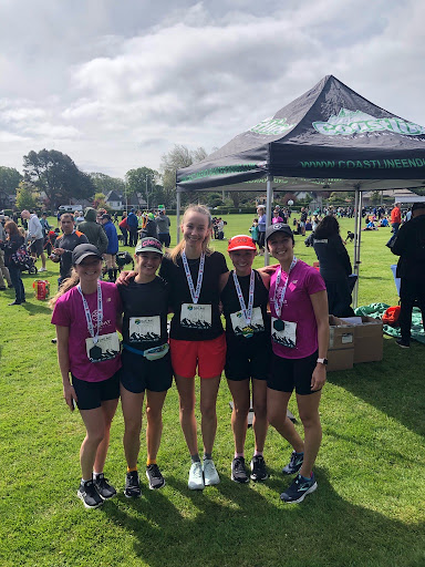 Emily Jackson completing a running race with friends