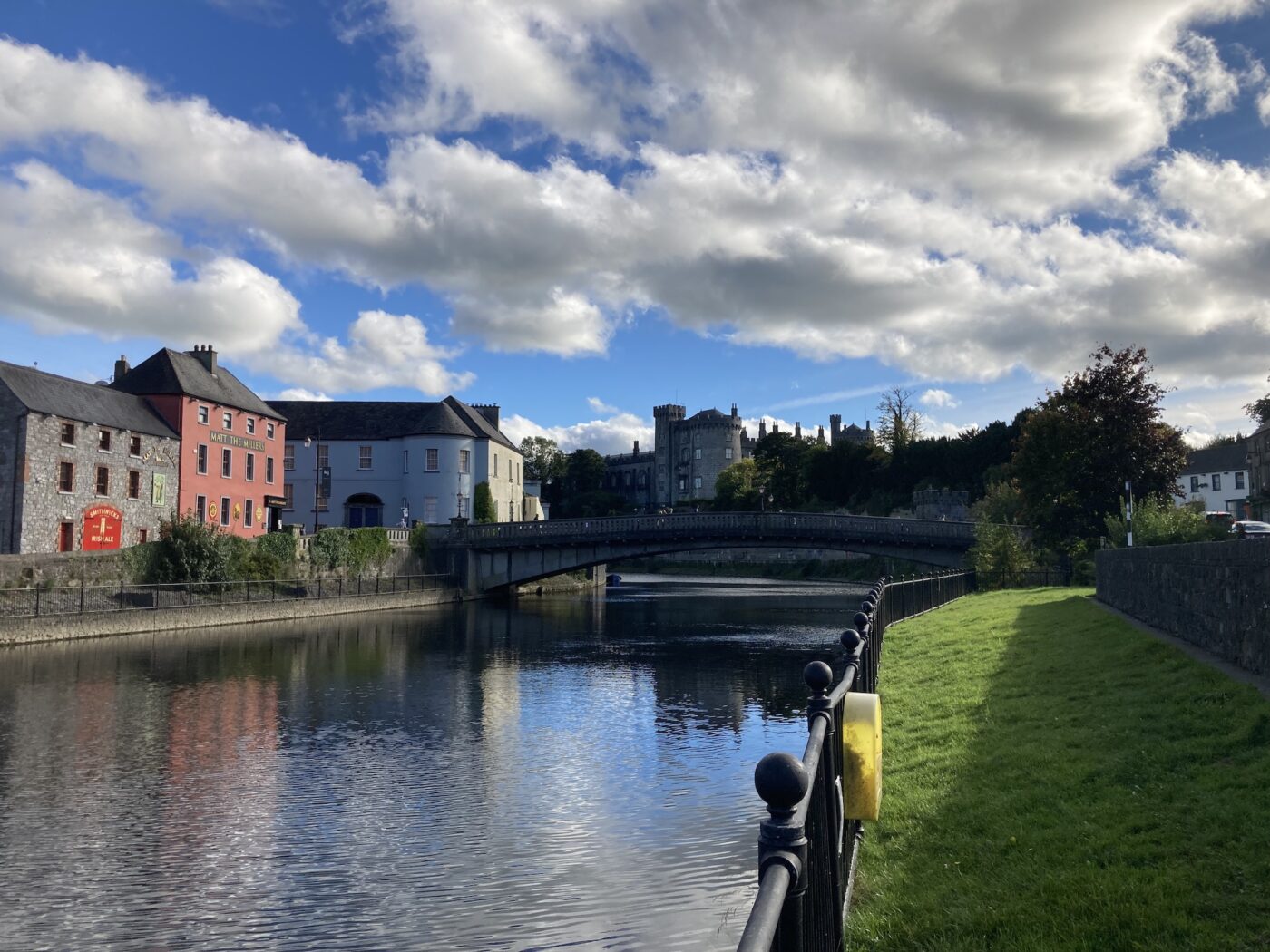 A photo taken by Joseph Rector, of Kilkenny, Ireland with castles, bridges, and a river running through the village.